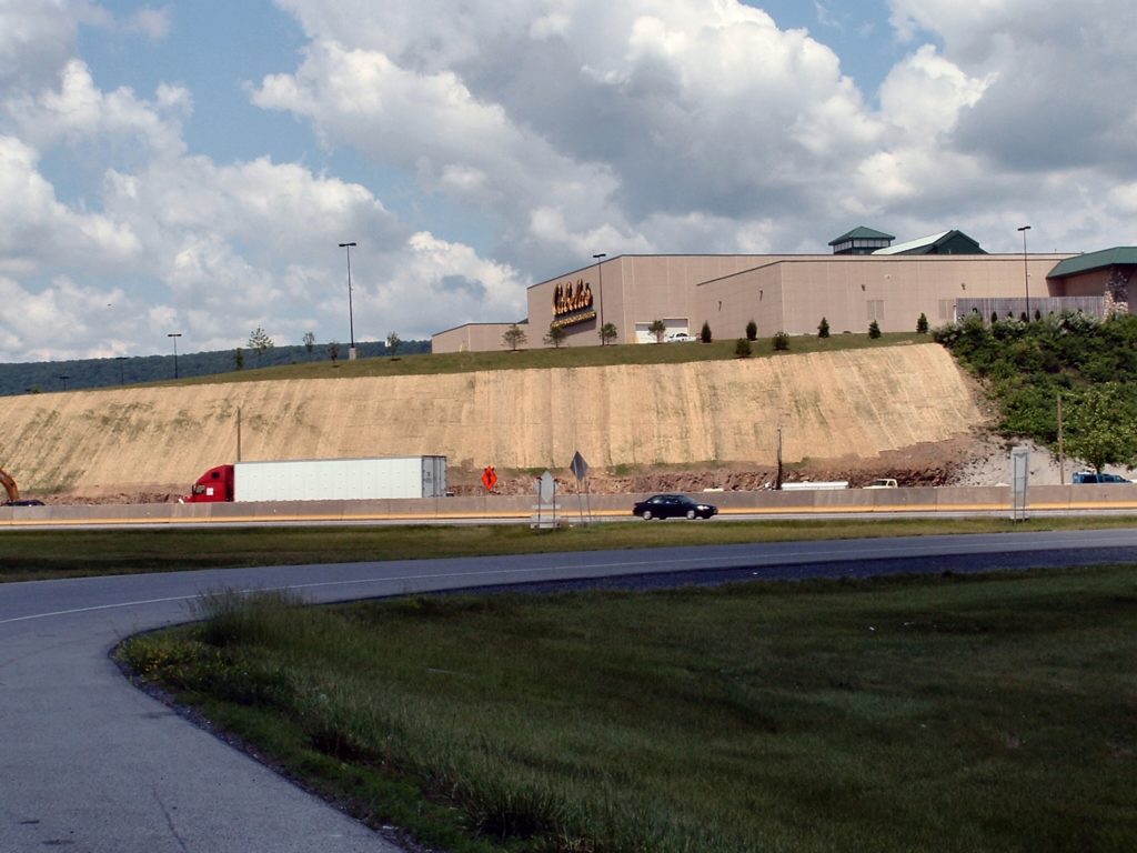 Erosion control blankets being used along a highway