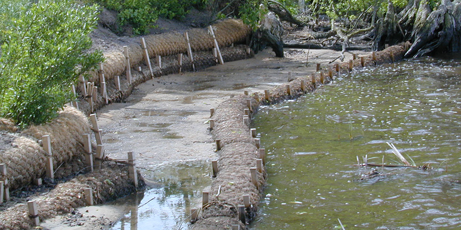 Coir logs being used in stream restoration